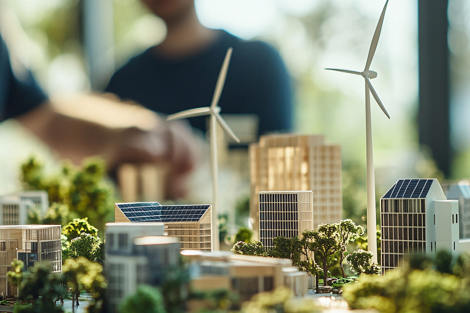 architecture model with wind turbines, solar panels, and green building design in office 